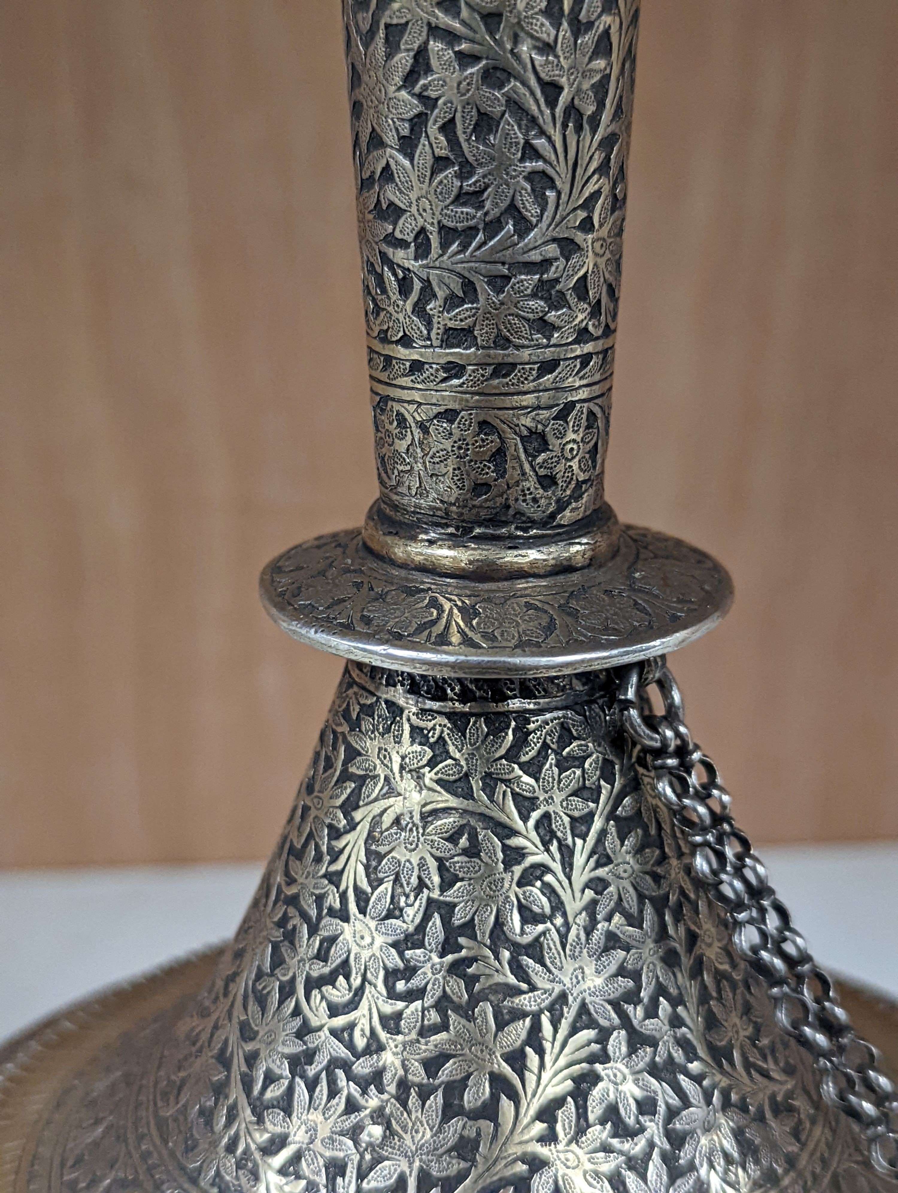 A 19th century North Indian silver surahi with engraved shawl decoration 30cm